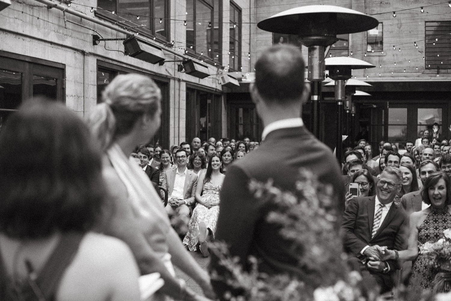 Couple looking at audience on their wedding day in San Francisco.