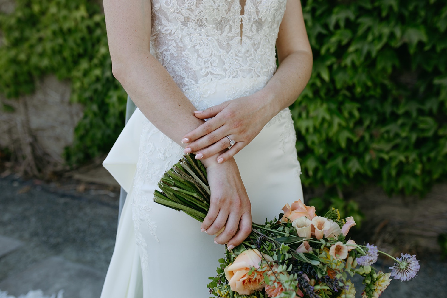 Bride holds a bouquet of flowers on her wedding day