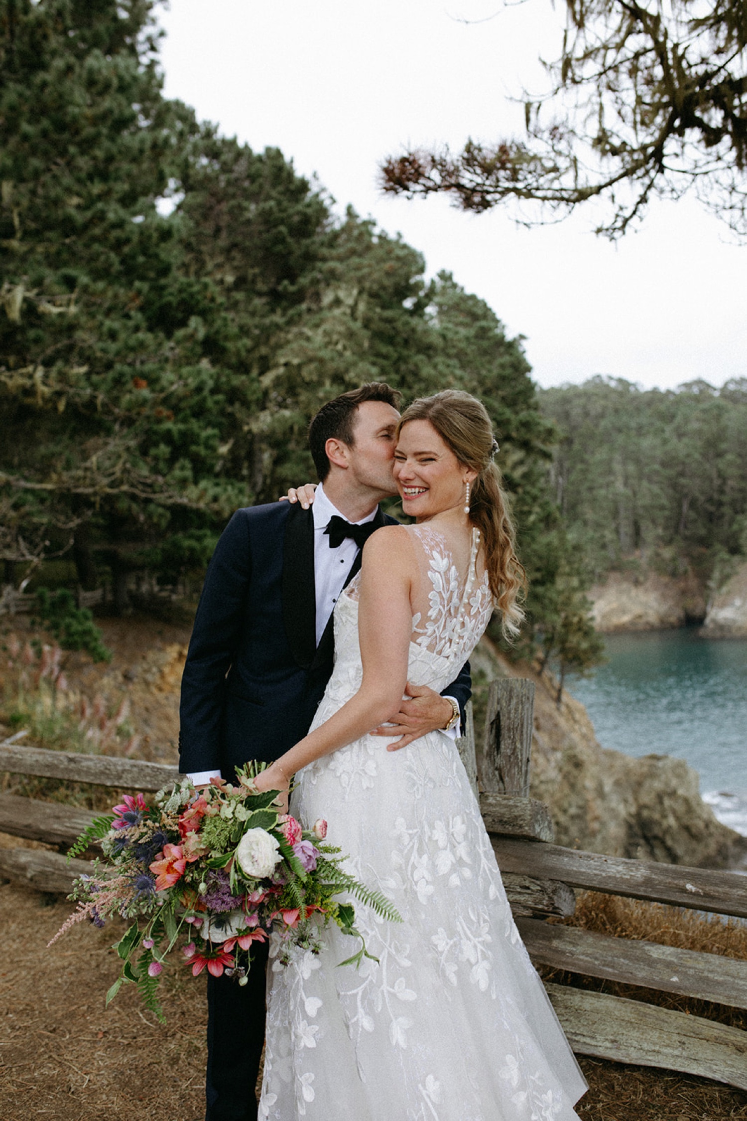 Bride and groom embrace on their wedding day in Mendocino