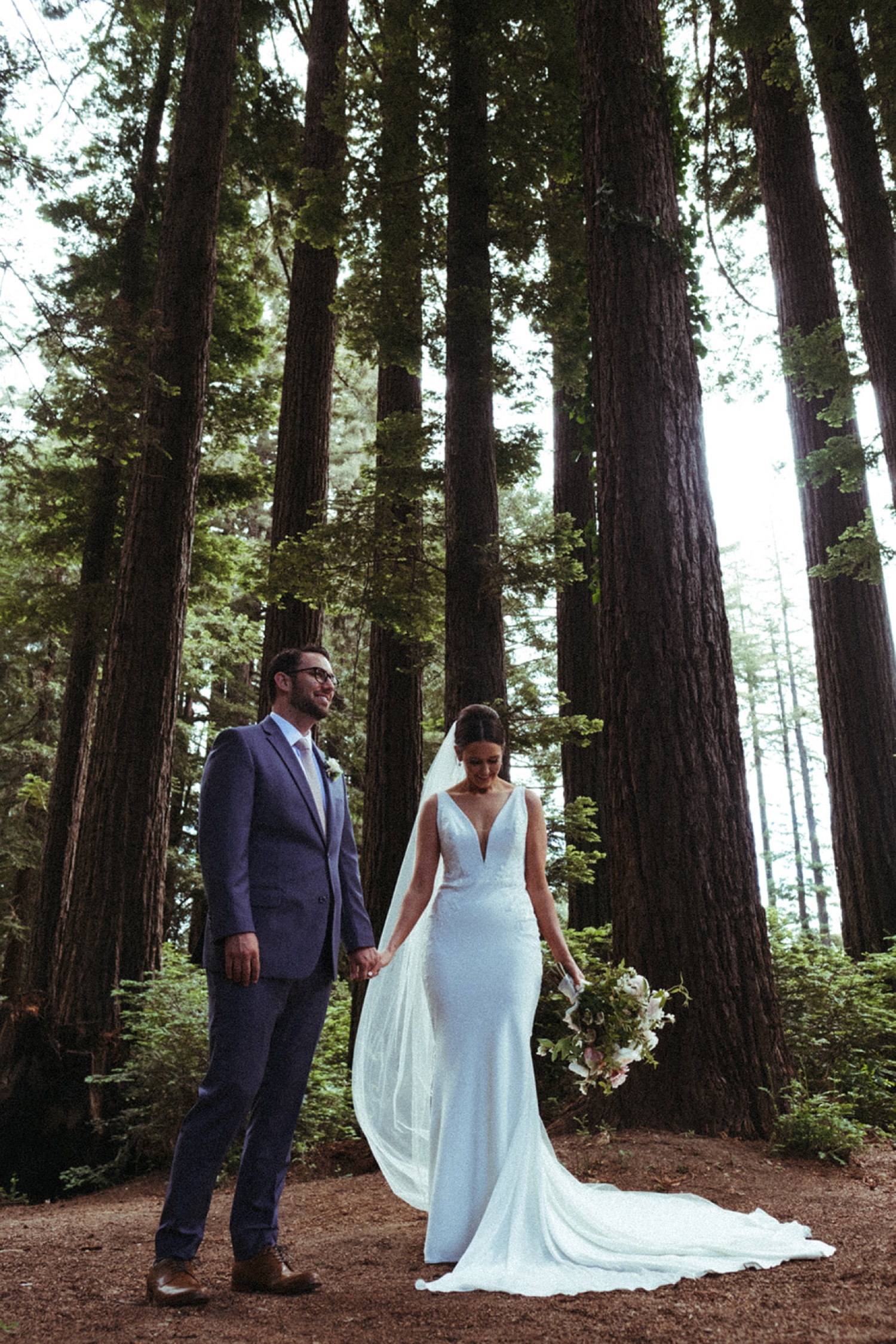 Bride and groom hold hands on their wedding day in the Bay Area