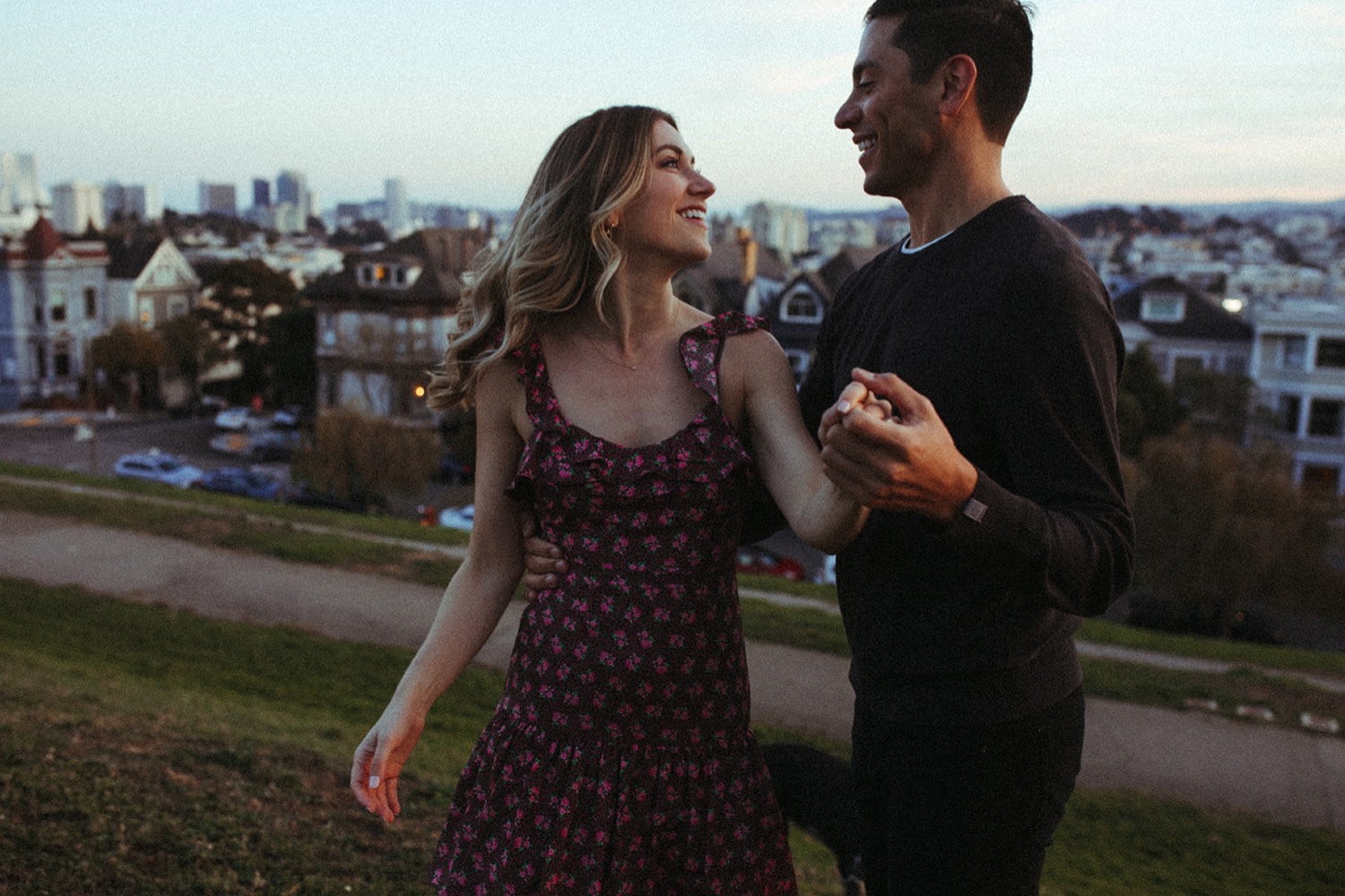 Couple dance in San Francisco during their engagement photos