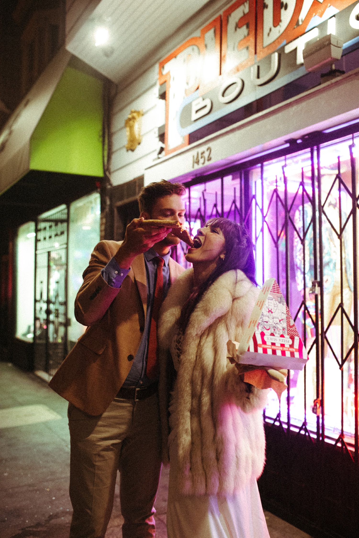 Couple enjoy pizza in San Francisco for their engagement photos.