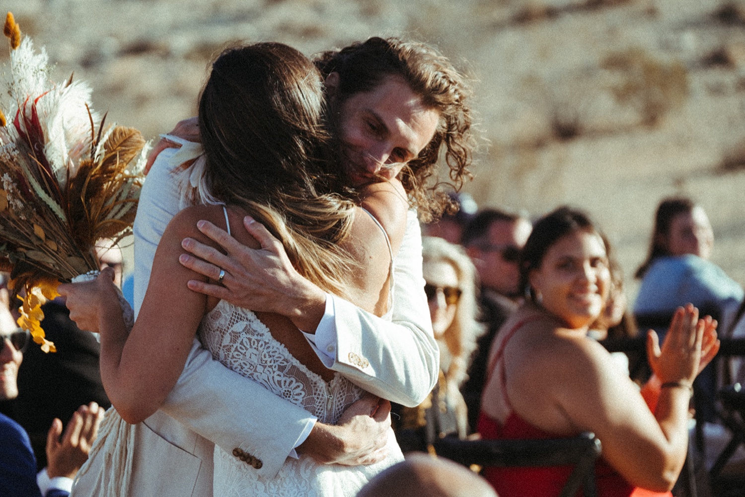 Bride and groom hug on their wedding day in Joshua Tree