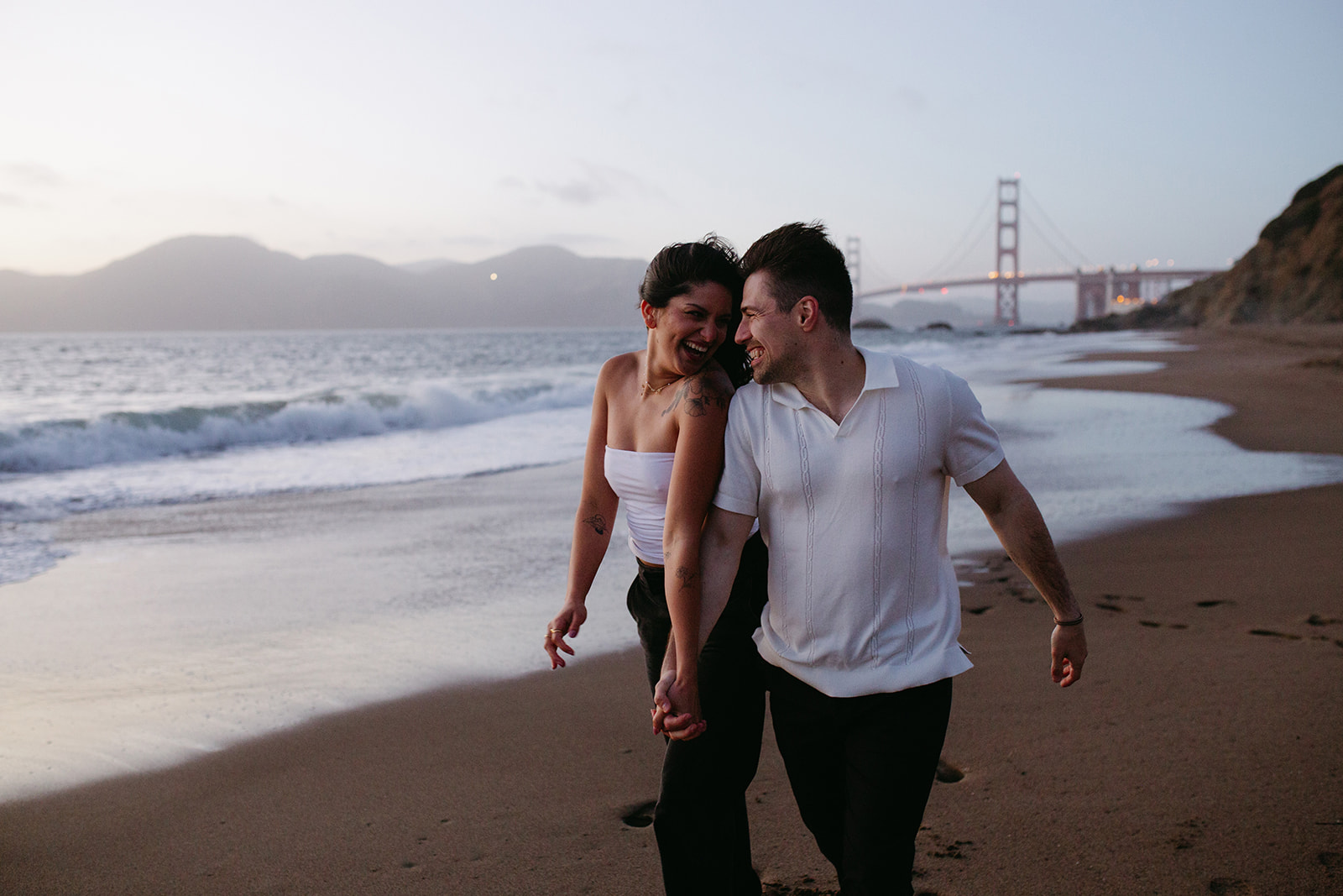 engaged couple on the beach in San Francisco photographed by Stephanie Klotz Photograpy